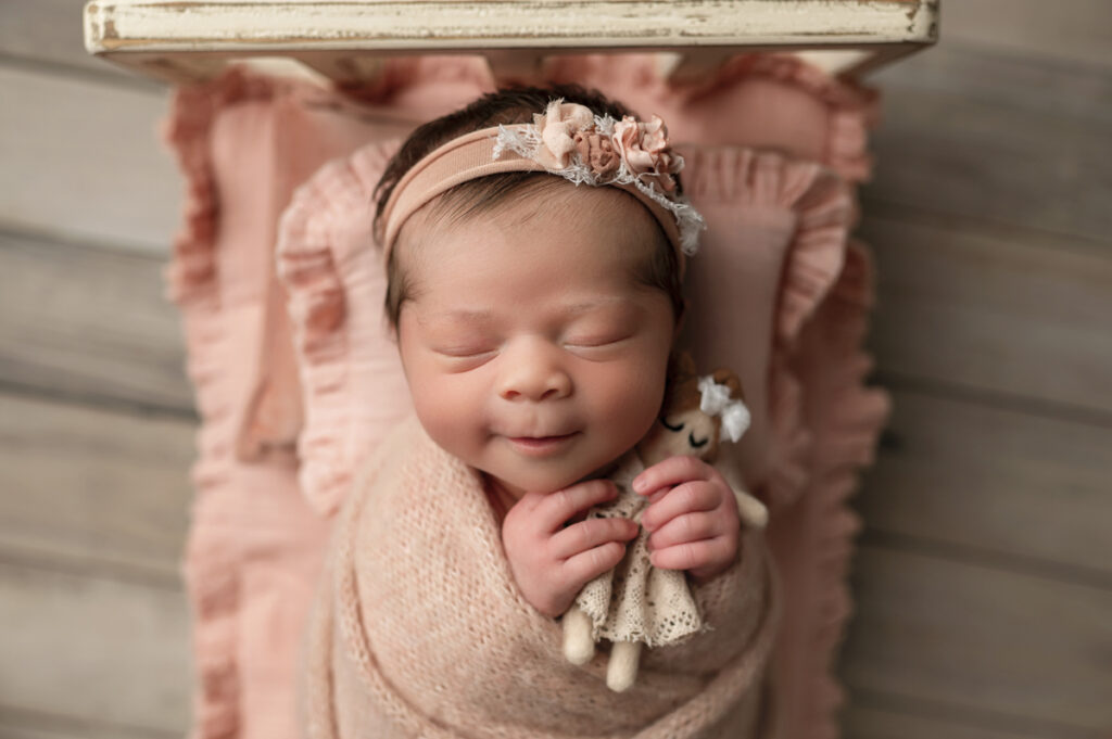 Newborn girls in peach