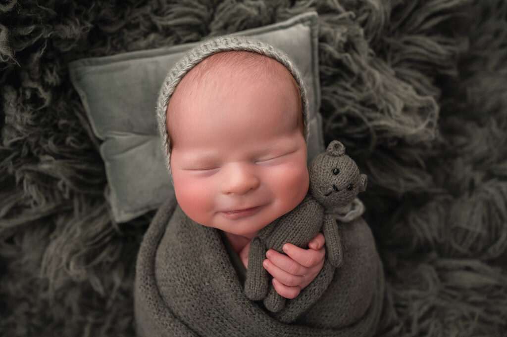 Wrapped babies smiling